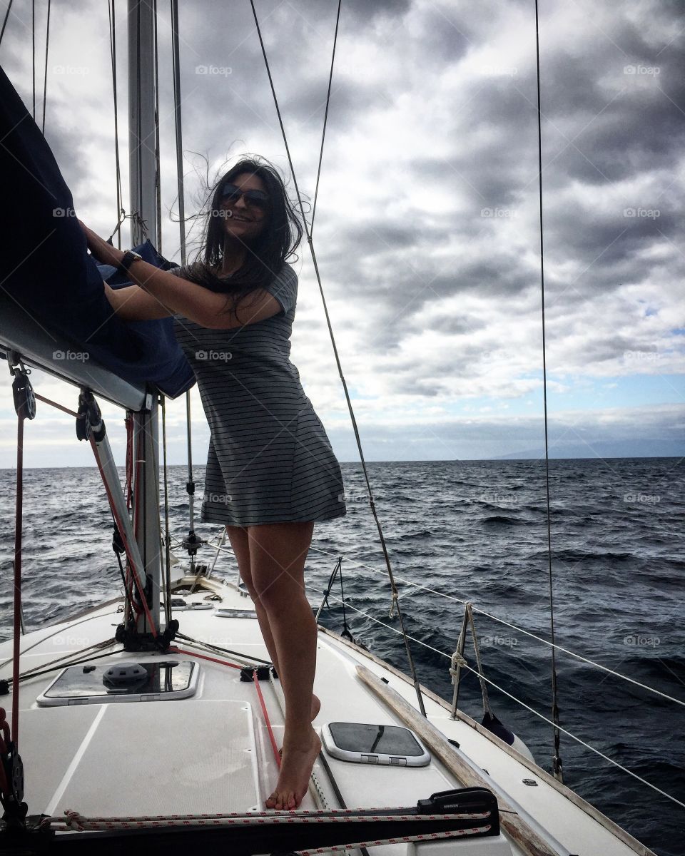 Woman standing in ship on sea