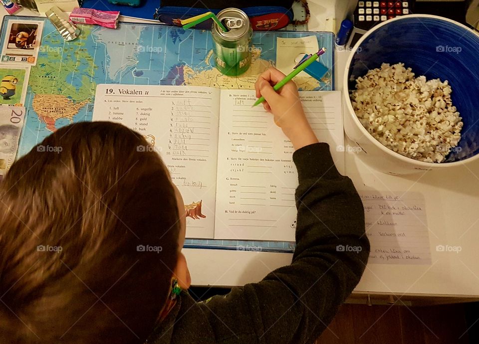 Homework with popcorn and soda.