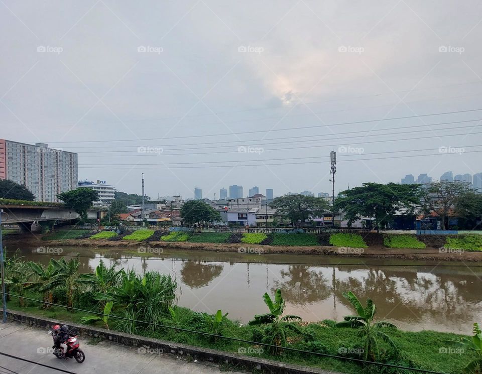 big river in the middle of residential area