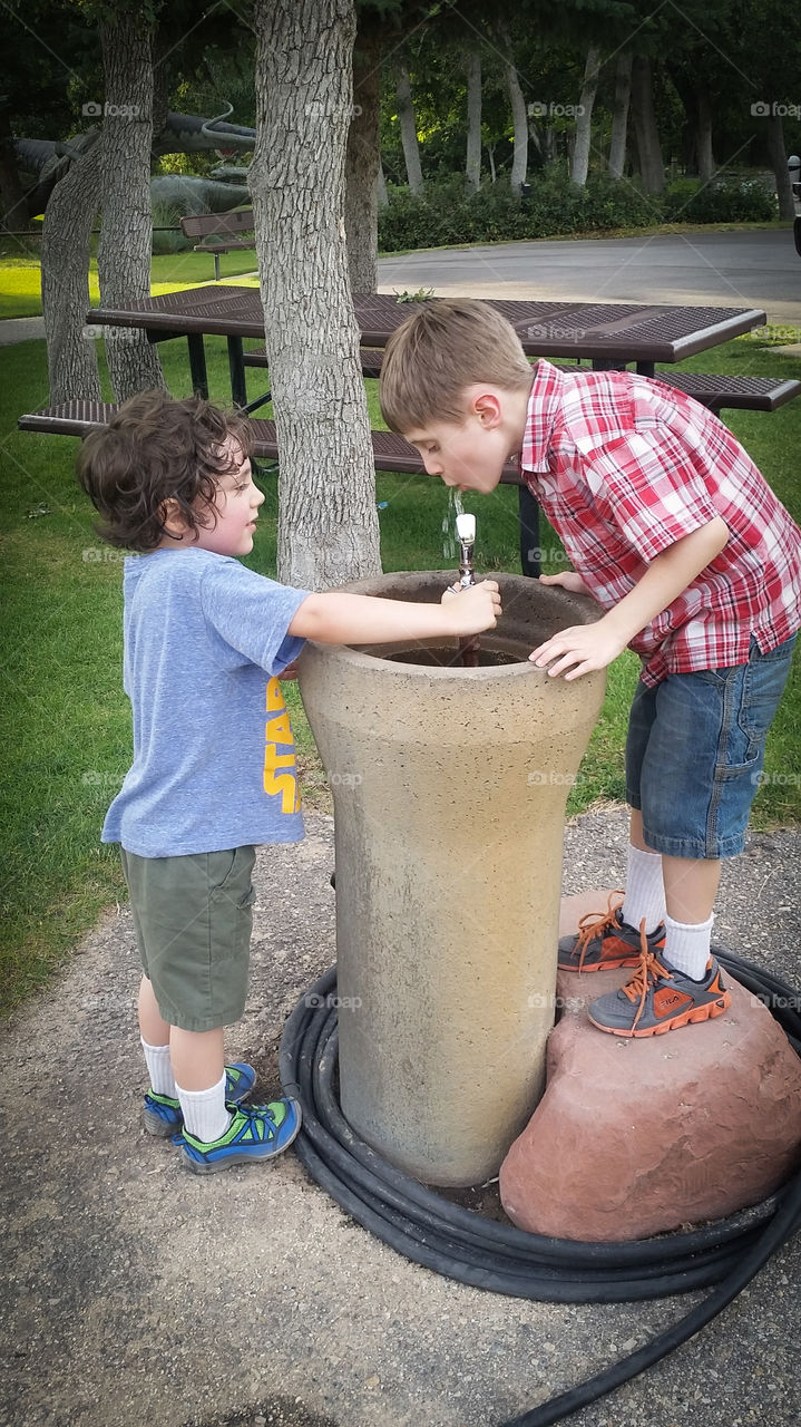 boy helping  his brother