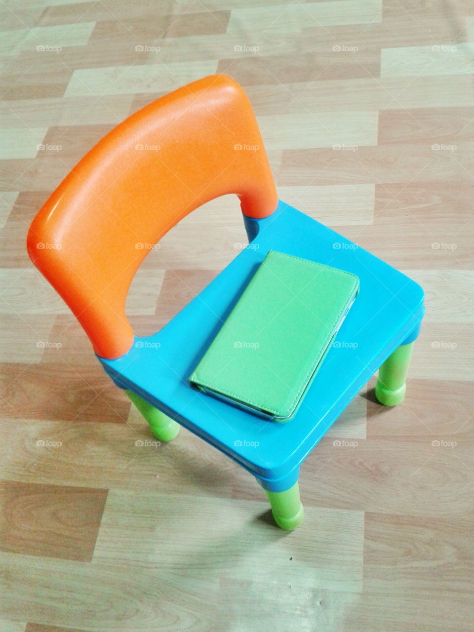 multi-colored chair with tablet. just a small chair and my tablet 