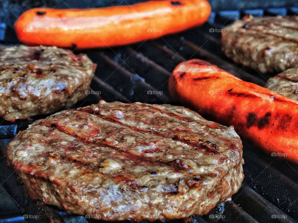 Hamburger and hot dog on grill