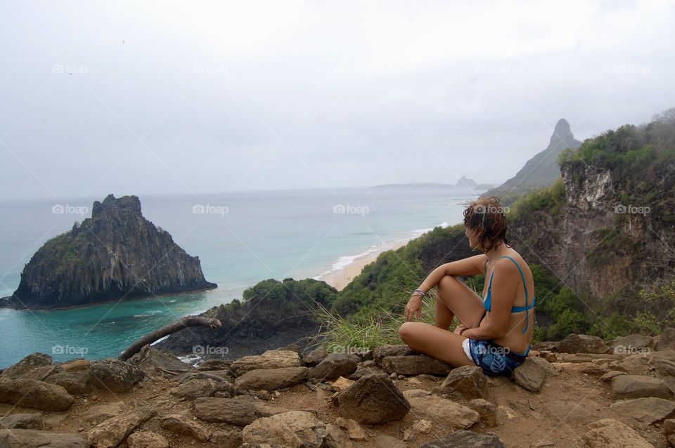 Woman looking sea horizon from island . Brazil 