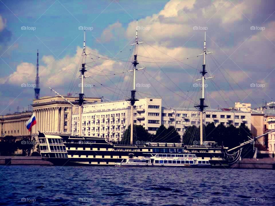 An old hip in St. Petersburg.. A tour on Neva river in St. Petersburg, Russia. 
A riverboat in the foreground.