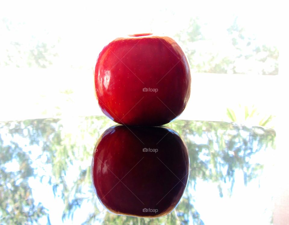 Red apple and reflection