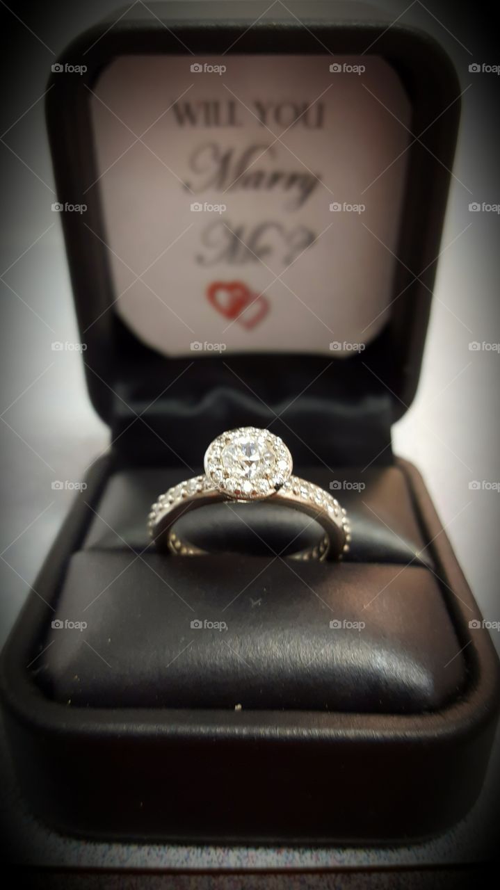 An offering of a diamond engagement ring leads to decision making about the future.