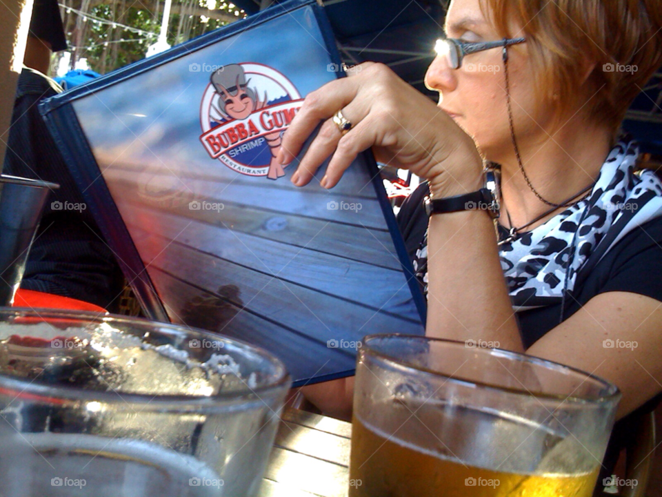 woman restaurant beer reading by jmsilva59