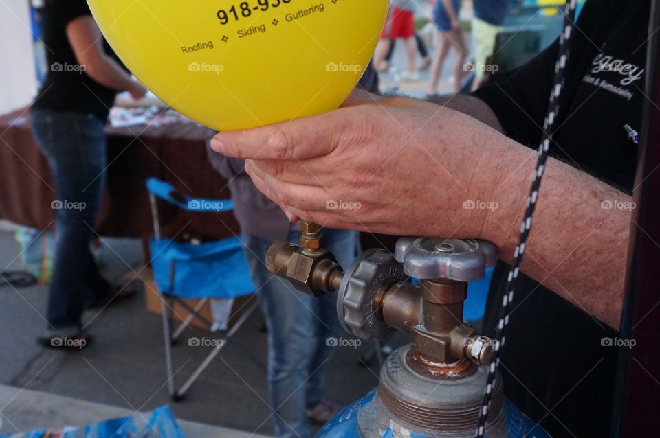 Yellow balloon . Helium tank