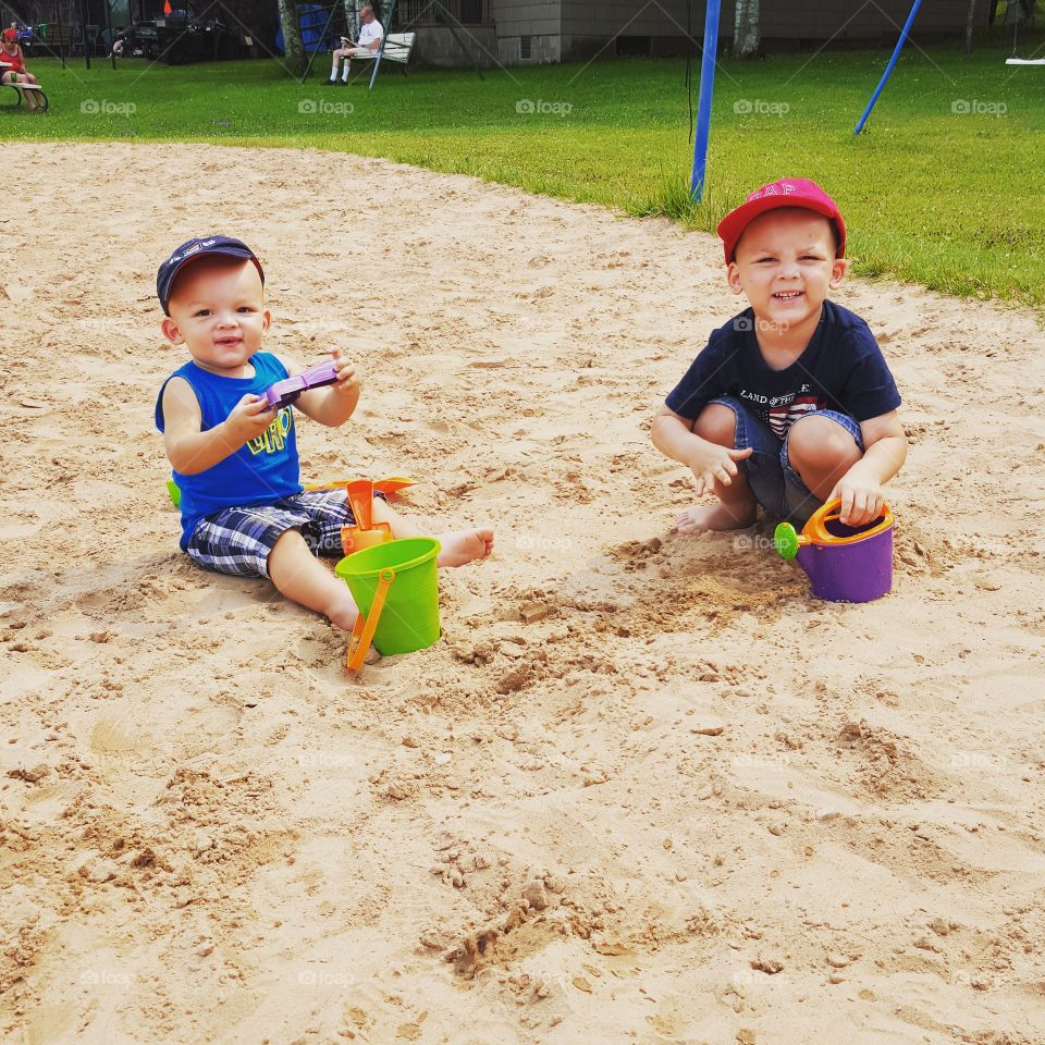 Brothers Having Fun in the Sand