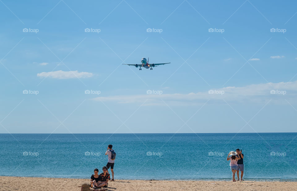 Air plane landing in the beautiful sea scape view in the southern of Thailand