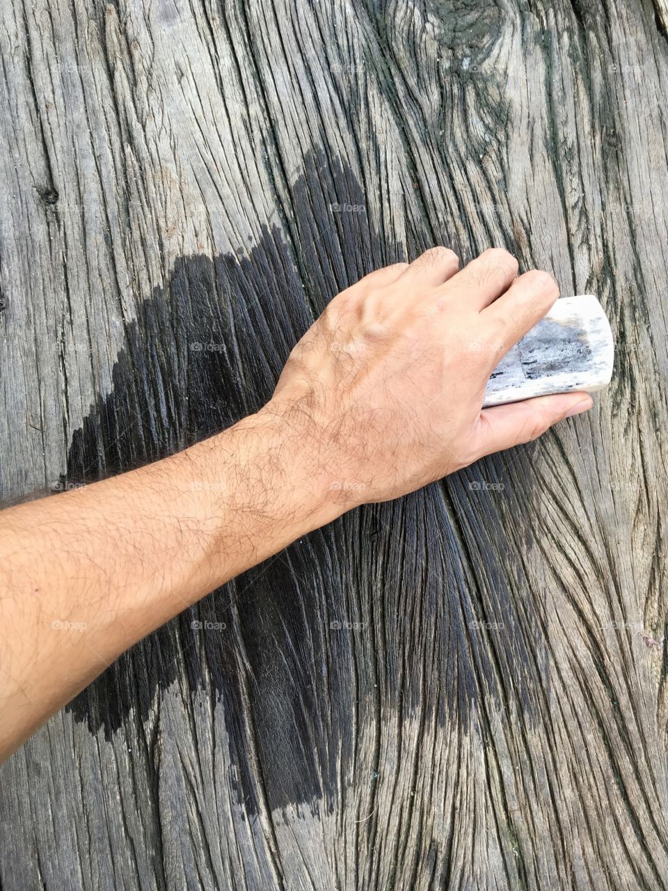 Close up hand man cleaning wood floor