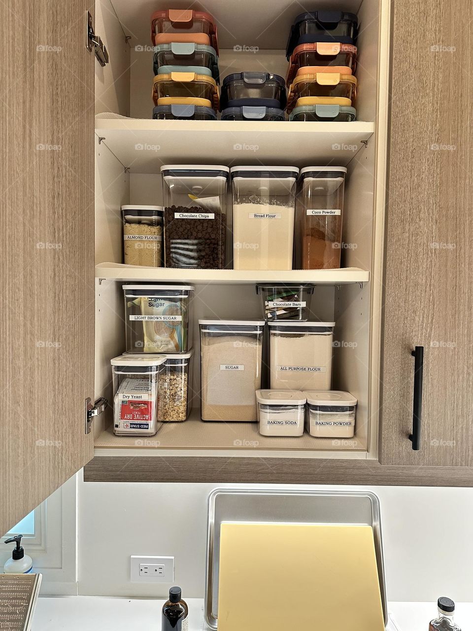 Nicely organized cupboard, chef organizes kitchen, getting organized in the kitchen, labeling containers in the cupboard, food organizer