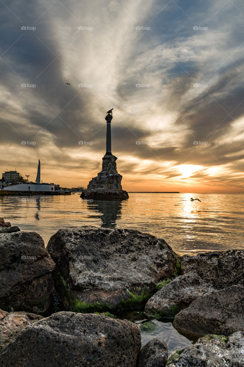 monument to the scuttled ships in the center of Sevastopol during sunset