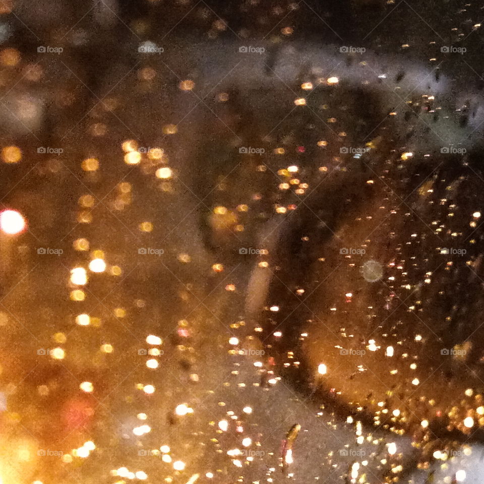Night view rain water plash on my car window glass