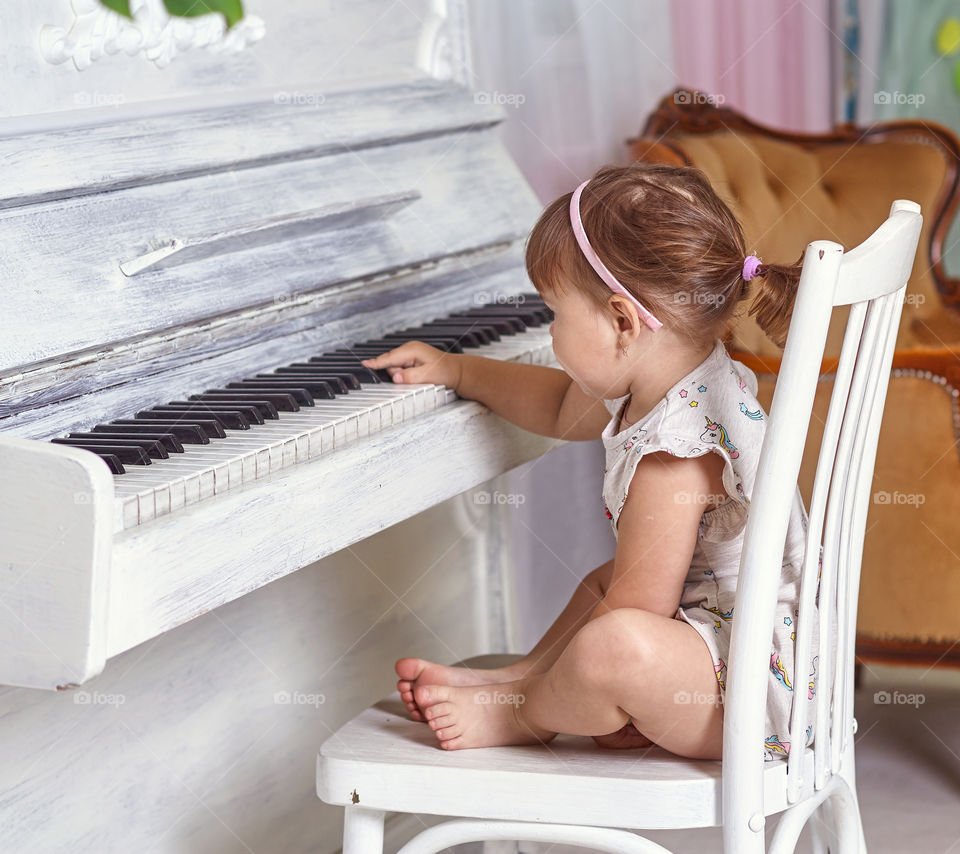 girl playing the piano