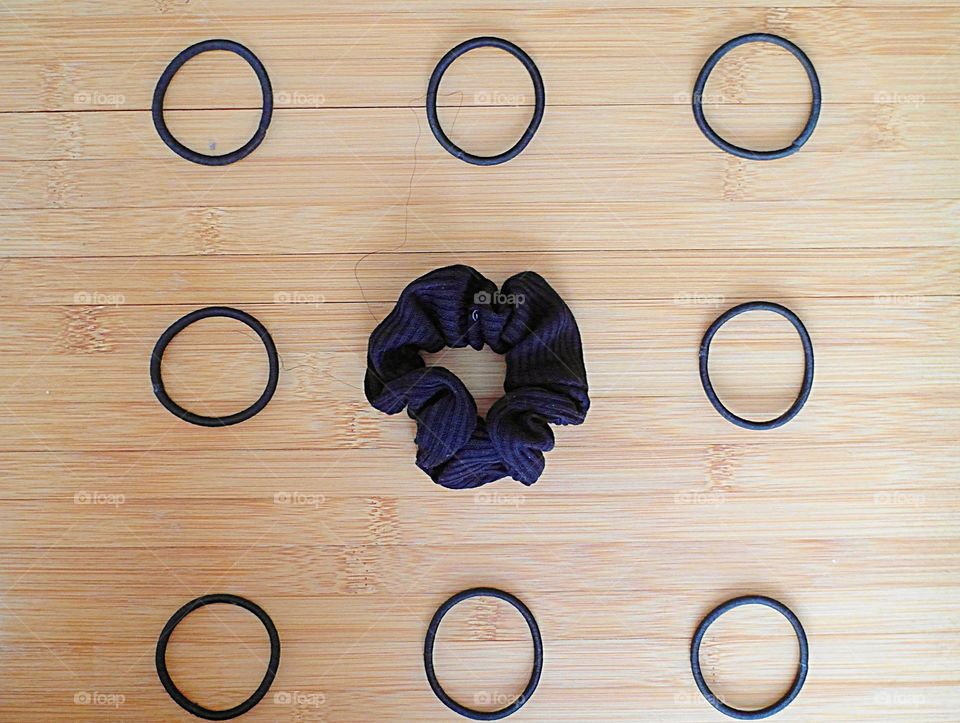 Hair accessories arranged on a wood surface