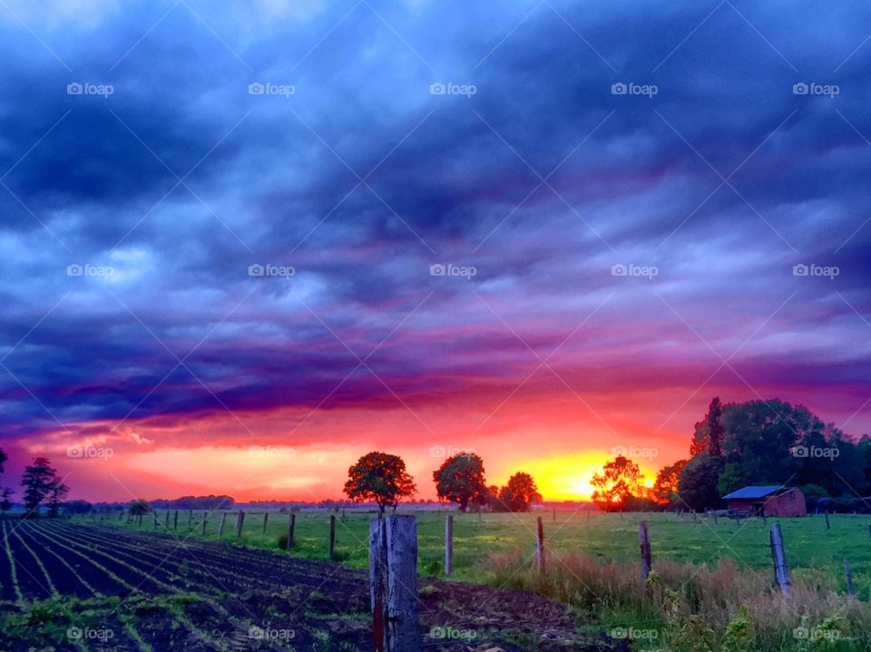 Colorful sunrise under stormy Clouds