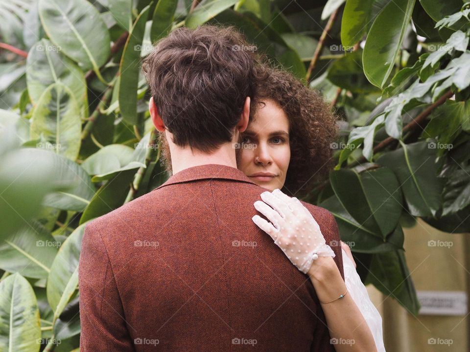 Beautiful lovers in botanical garden 