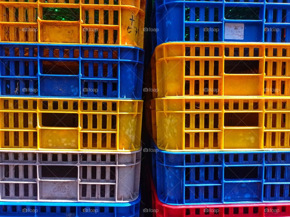 Arrangement of colorful plastic baskets for storage of various items.