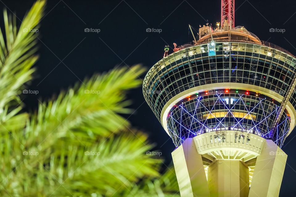 Stratosphere Casino and Hotel in Las Vegas, NV, USA. Palm trees in bokeh. 