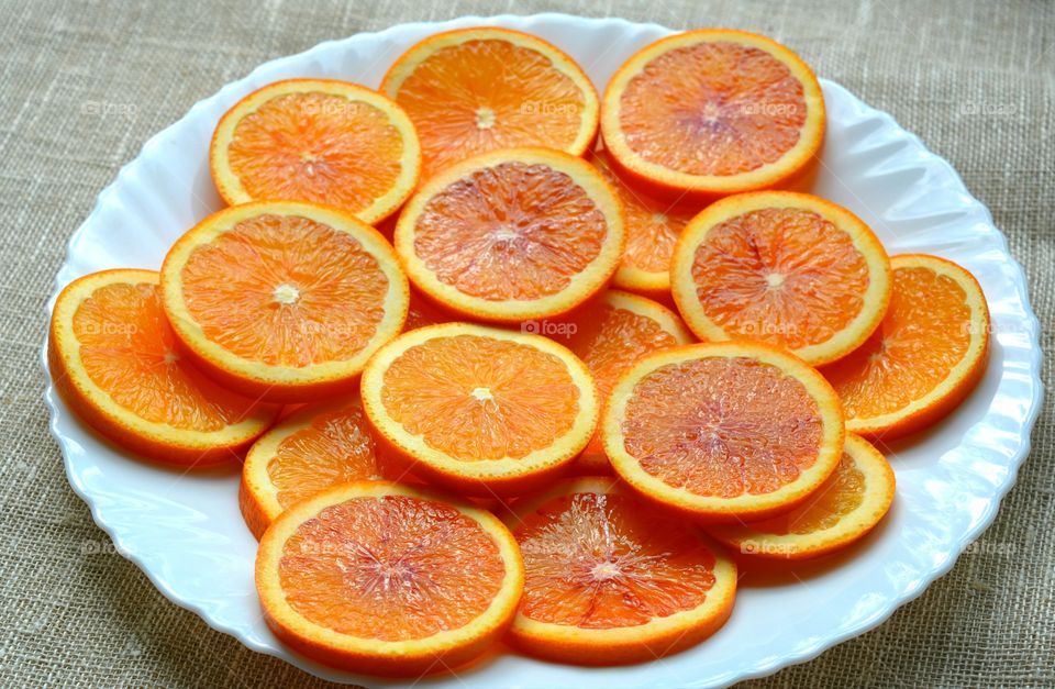 orange citrus fruits on a plate texture natural background