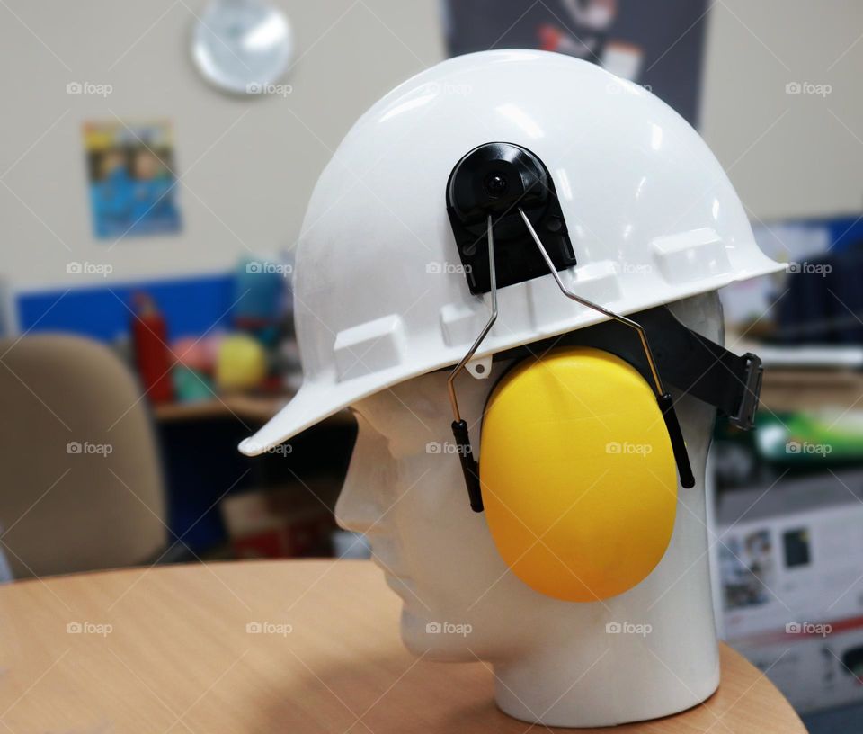 Helmet and earmuff photo, these two objects are one of the safety tools for workers to protect them from work accidents