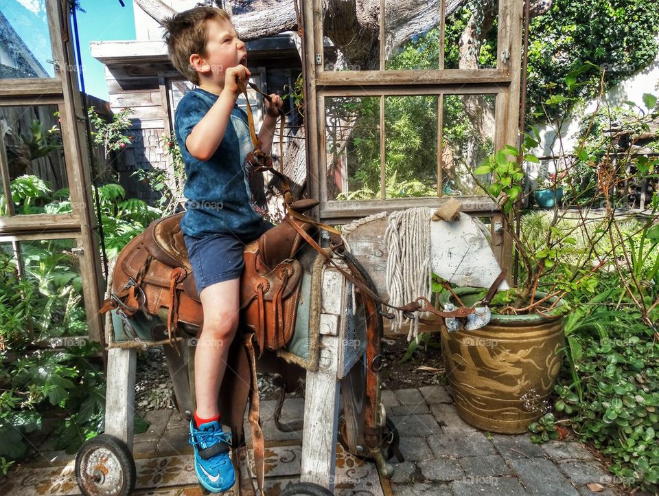 Young Boy Playing Cowboy