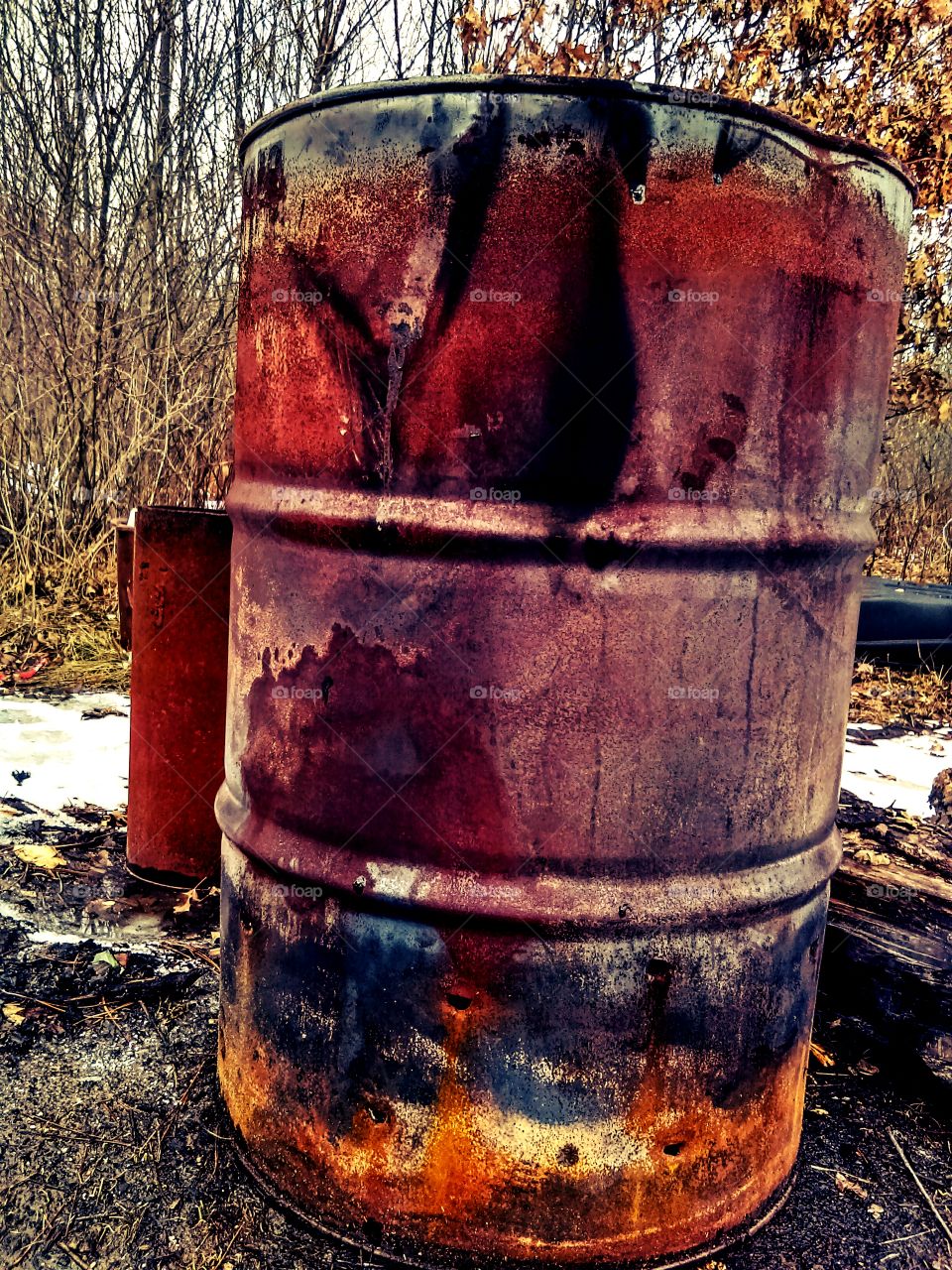 oil can and industrial chimney pipe.