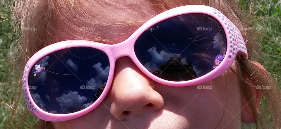 head in the clouds. my daughter gazing at the beautiful sky