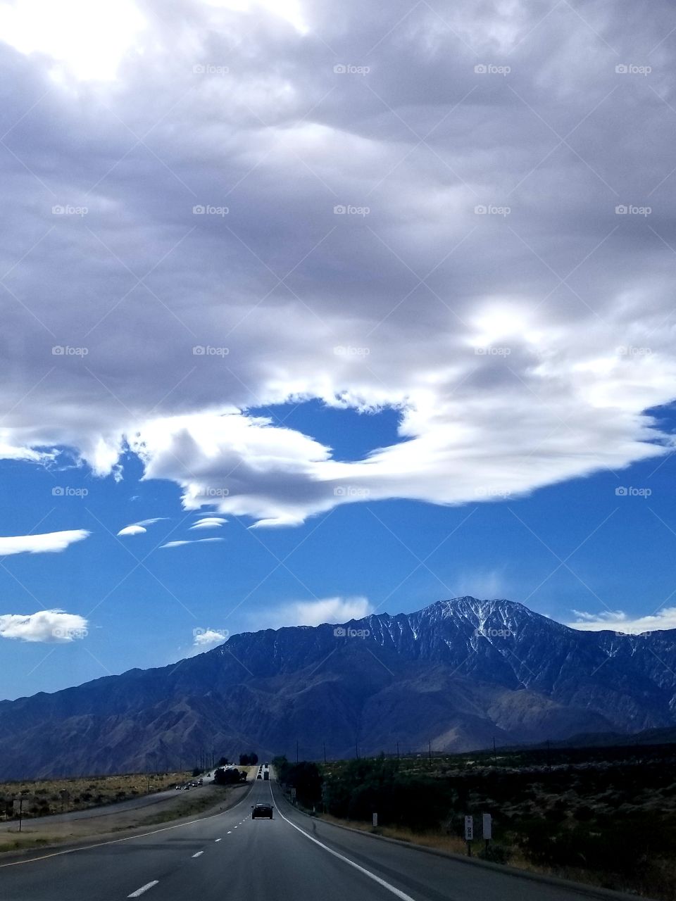 Road Trip III: desert highway with mountains and clouds