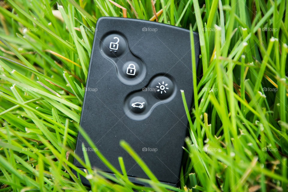 Remote car key in the grass