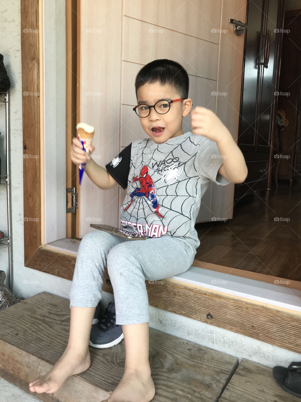 Eating an ice cream while enjoying the picture taking from my iPhone