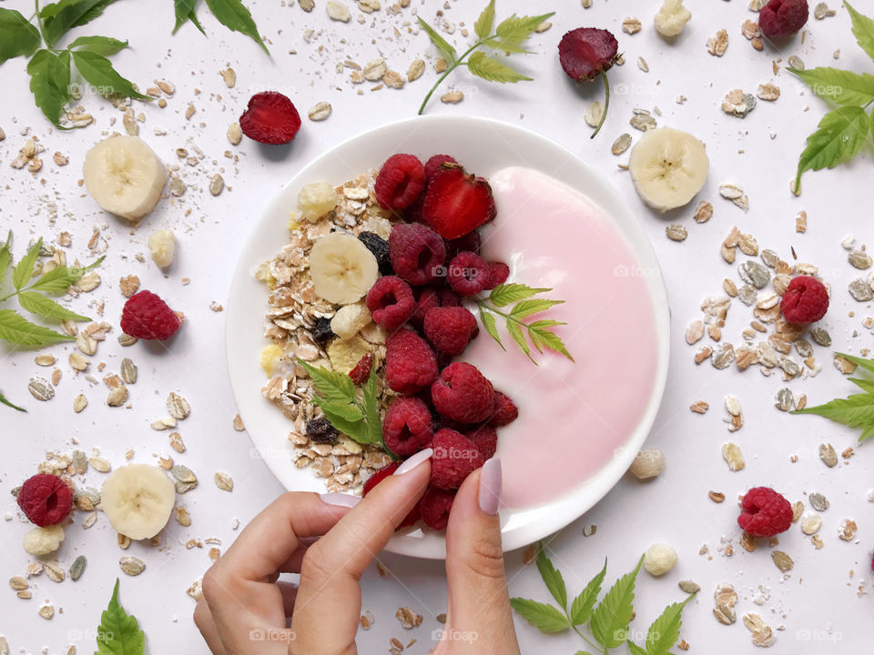 Yogurt with muesli and berries for breakfast 