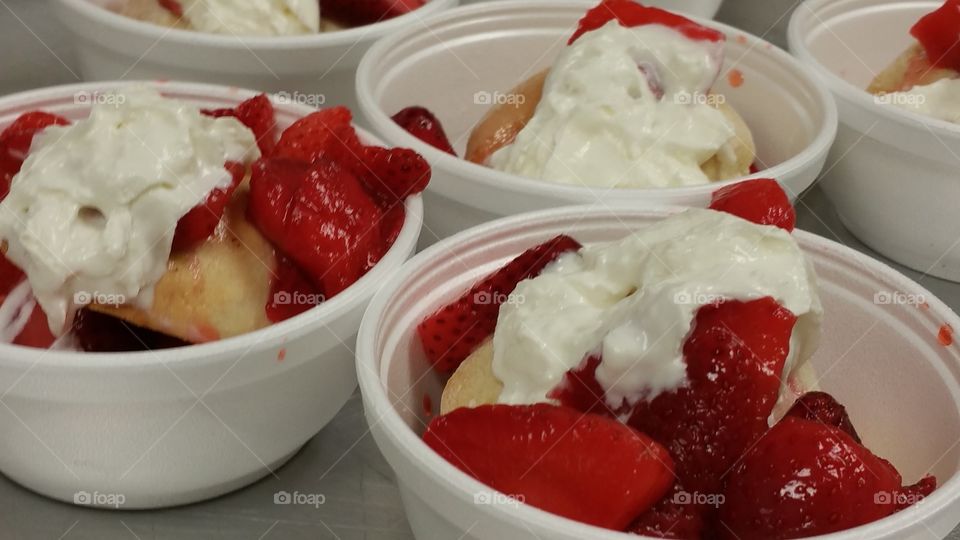 Strawberry Shortcake. Serving desert at a luncheon.