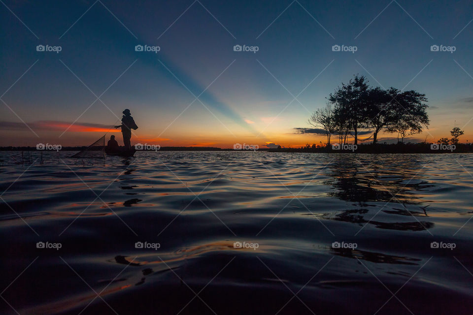 Fisherman actoin at the sunset. Fisherman actoin at the sunset