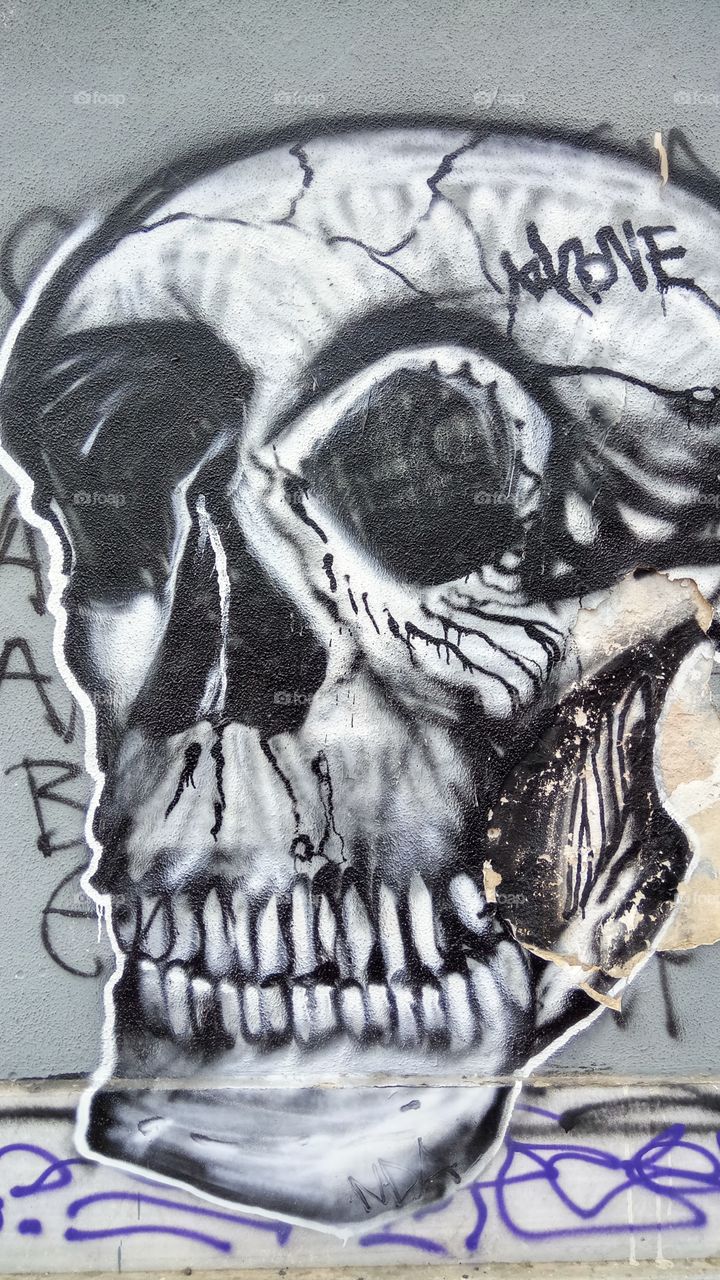 Eerie skull graffiti on the streets of Athens,Greece