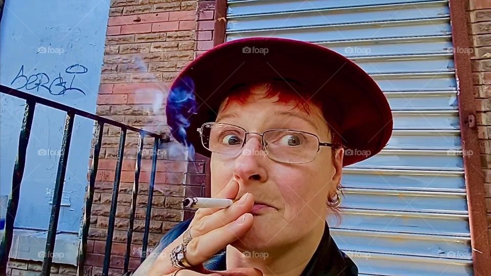 By all means enjoy that smoke, it could lead to relatively short lived happiness depending of course on what is in that cigarette but I’m not telling. This urban stoop impression was photographed in “Clinton Hill”, Bklyn. 2022. Hypnotic Productions