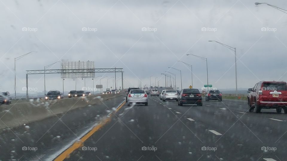 The rain continues to fall as commuters make their way to their destinations.