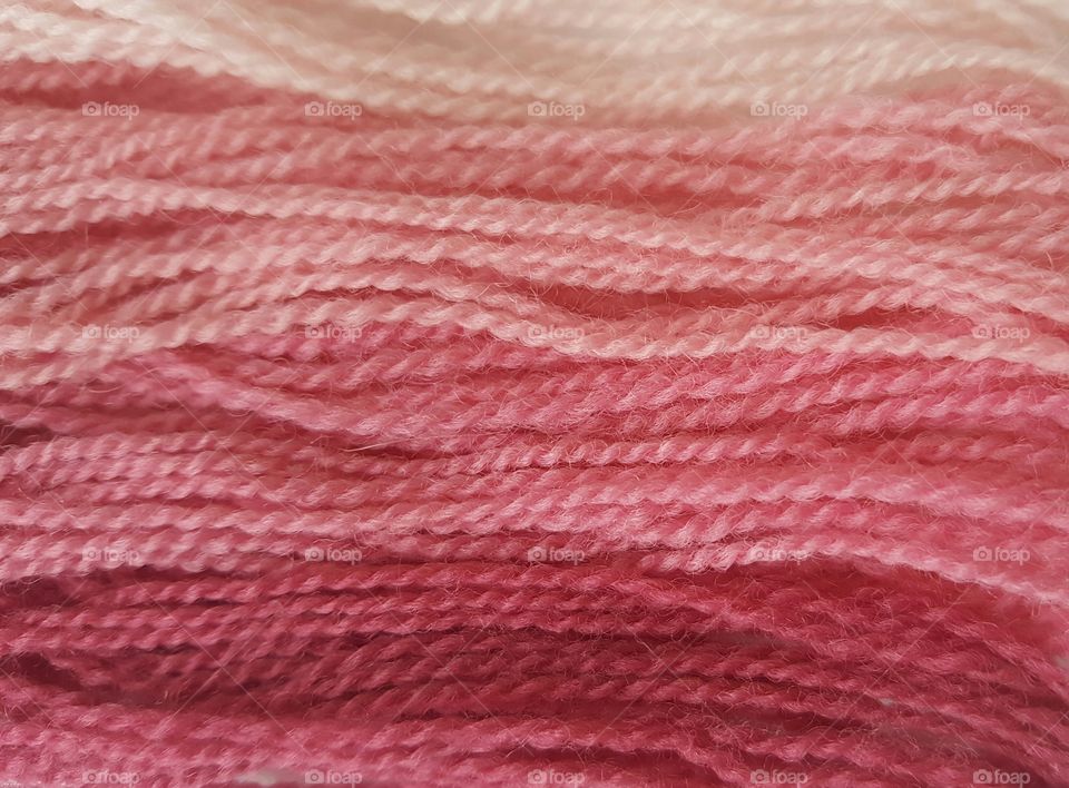 Close-up of yarn in multiple shades of pink