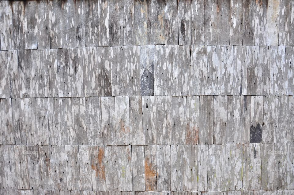 Gray slate wooden roof tiles texture.