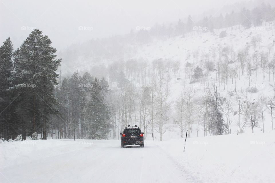 Driving in blizzard. Rocky Mountain National Park.