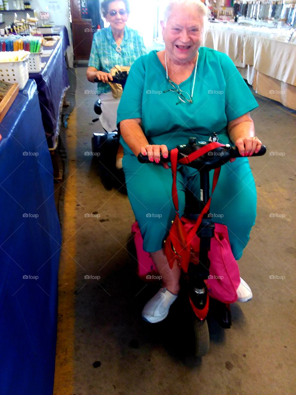happy scooter riders getting from point A to point B doing the days shopping at the local flea market