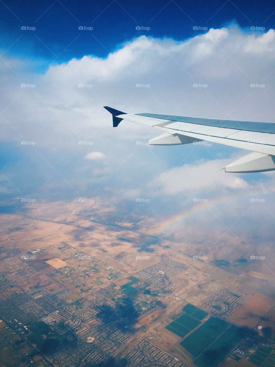 Airplane flying above city