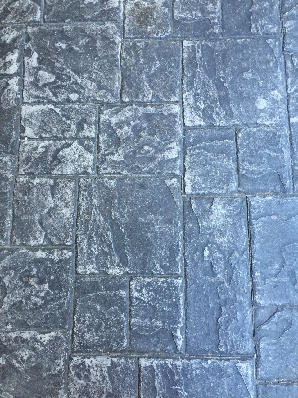 Stone background . Walkway at work, pattern in the sidewalk 