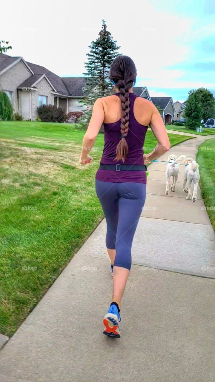 soccer mom running in suburbia with dogs