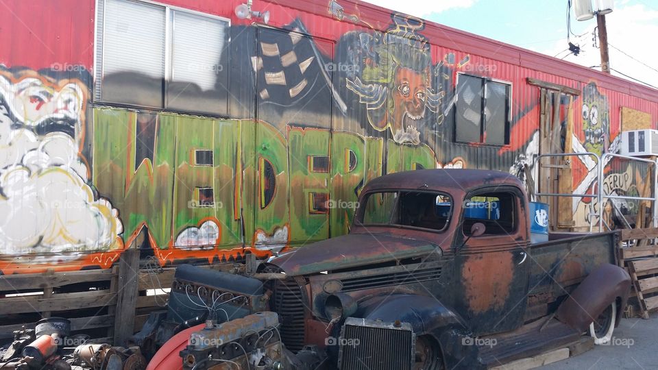 old vehicle in front of graffiti art Las Vegas
