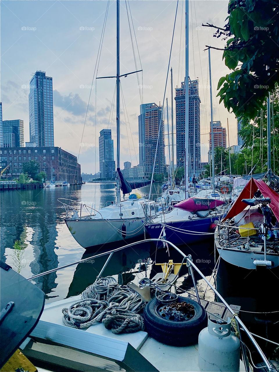 This view onto the boats of “Newtown Creek” beneath the “Pulaski Bridge” in LIC, Queens can only be enjoyed from aboard one of them. The sea is sleek, smooth and shiny tonight. 2023. Hypnotic Productions