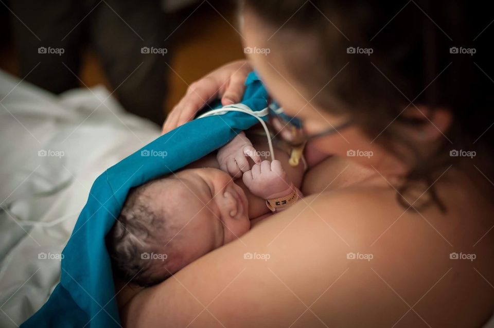holding a newborn baby