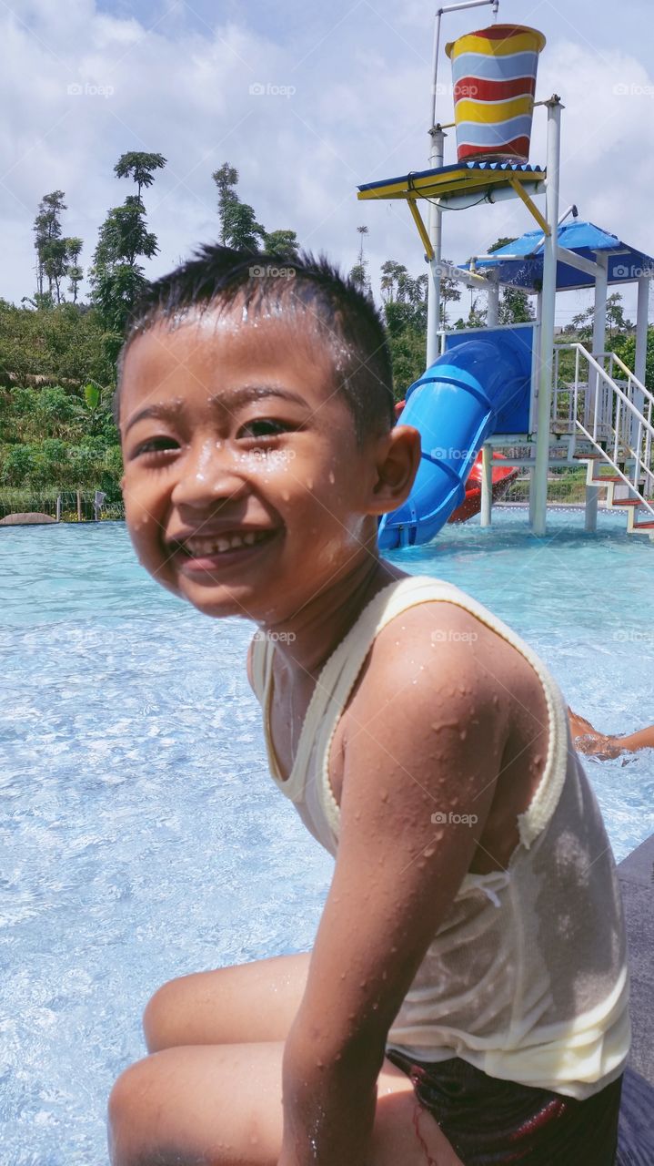 boy playing water