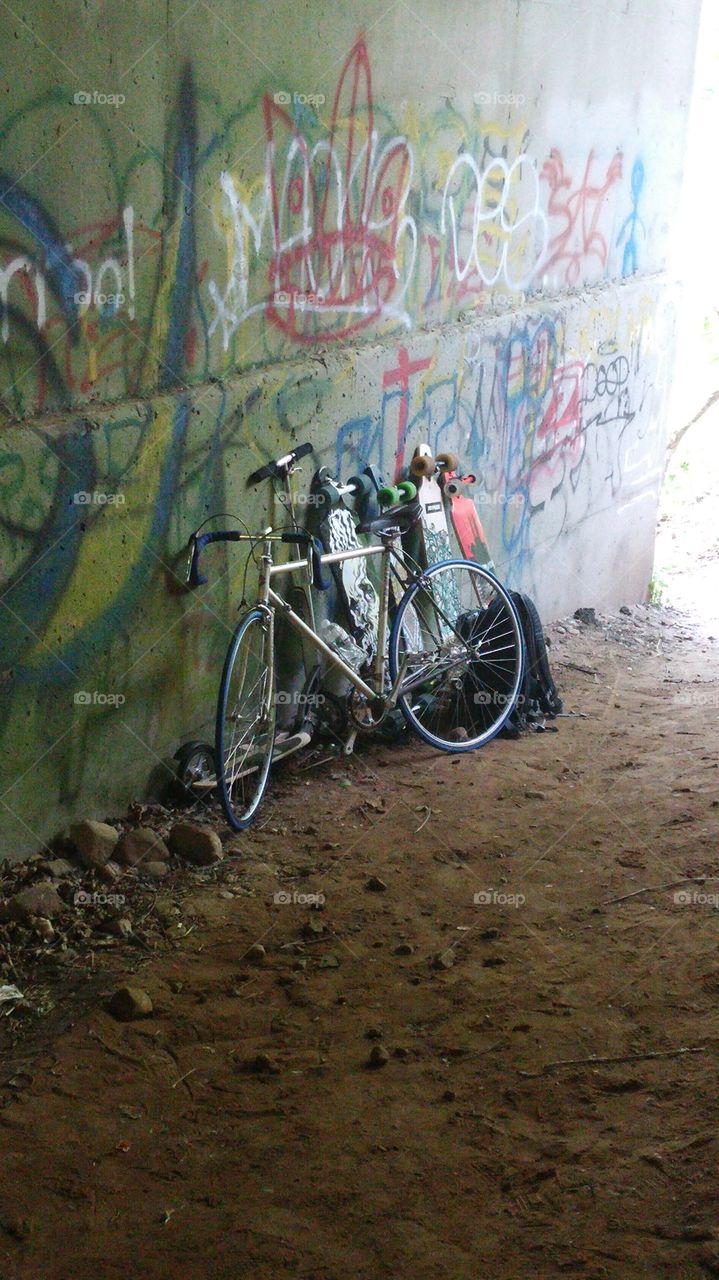 Board under a bridge. Went boarding down a path and we went under a bridge to chill...